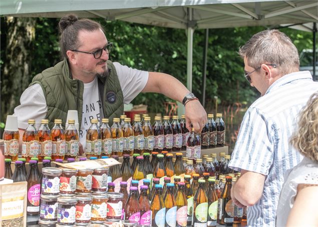 Photo d'un producteur sur son stand - Philophoto